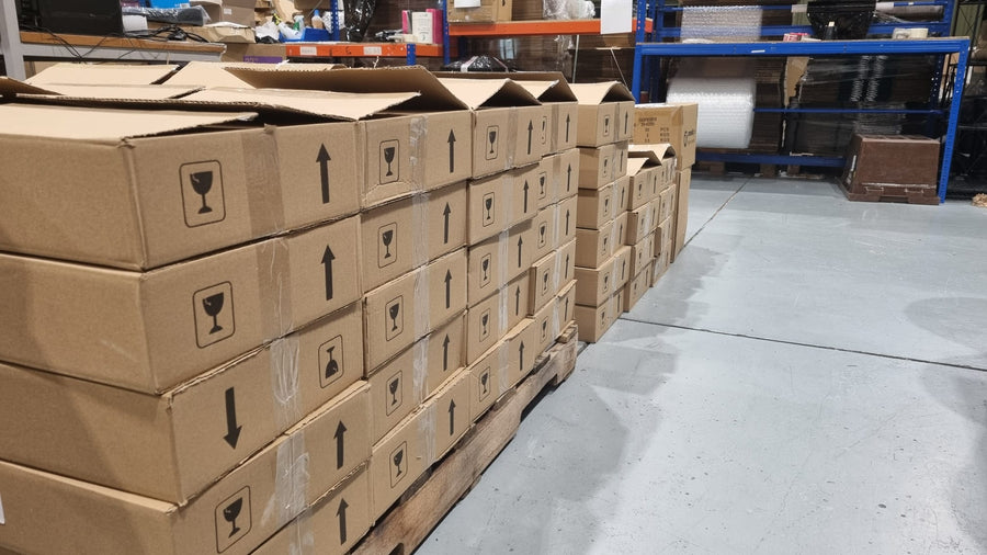 Boxed refurbished devices packed for dispatch