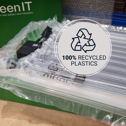 A close-up of a packaged product wrapped in clear bubble mailer plastic, with a green box partially visible behind it. A large circular overlay reads '100% RECYCLED PLASTICS' with a recycling symbol.